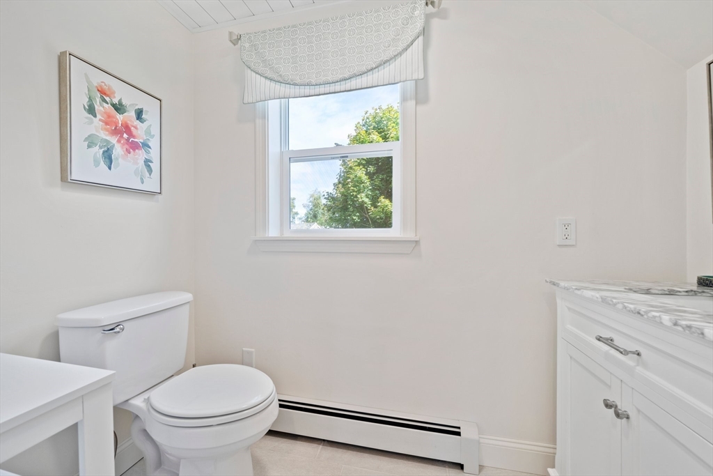 103 Williston Road Bourne, MA 02562 - Photo 23 of 40 a bathroom with a toilet a sink and a window