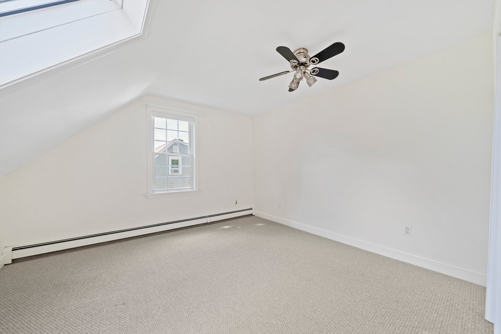 103 Williston Road Bourne, MA 02562 - Photo 24 of 40 an empty room with a window and a ceiling fan