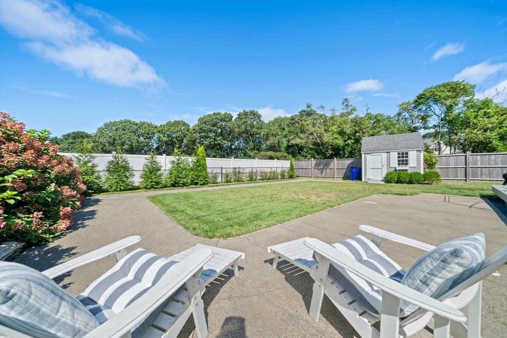 103 Williston Road Bourne, MA 02562 - Photo 31 of 40 a view of a house with a yard