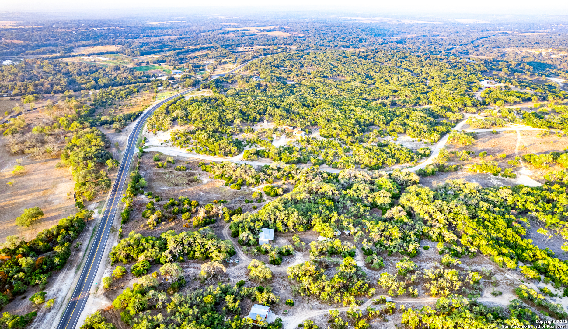 184 Peyton Colony Road Blanco, TX 78606 - Photo 18 of 33 an aerial view of residential house with an outdoor space and seating area