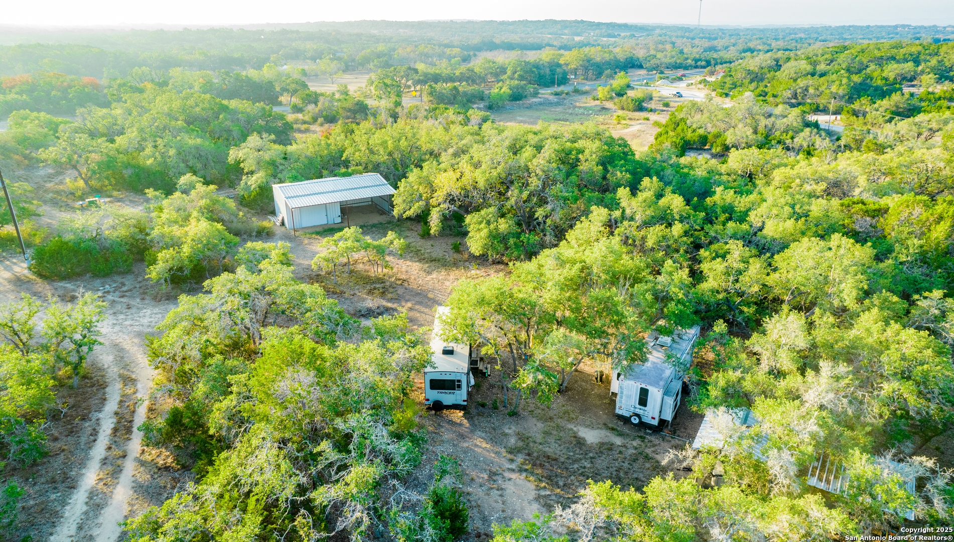 184 Peyton Colony Road Blanco, TX 78606 - Photo 30 of 33 a view of a city with lush green forest