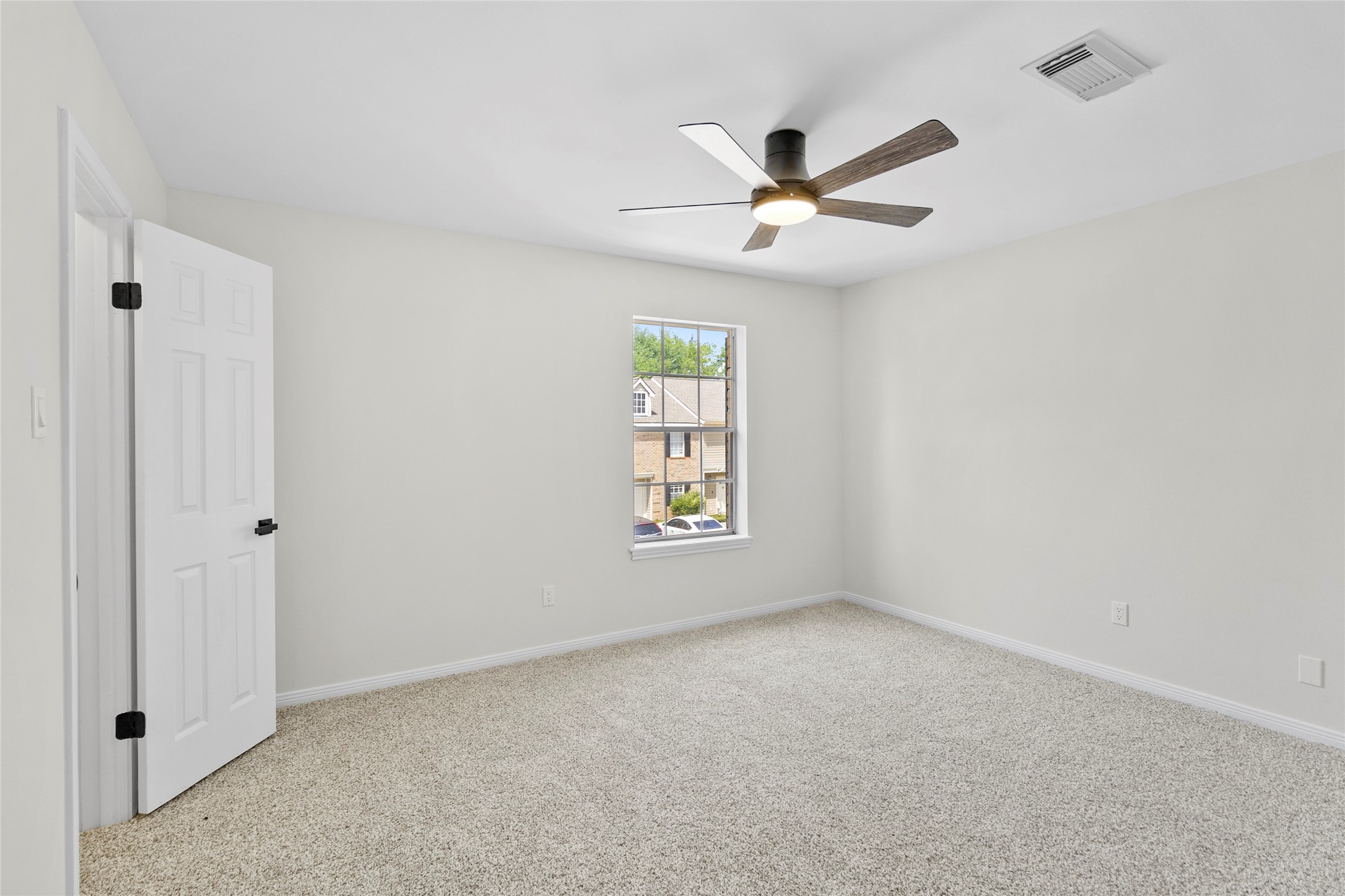 2030 Plantation Drive, Unit F3 Conroe, TX 77301 - Photo 15 of 22 a view of an empty room with a window
