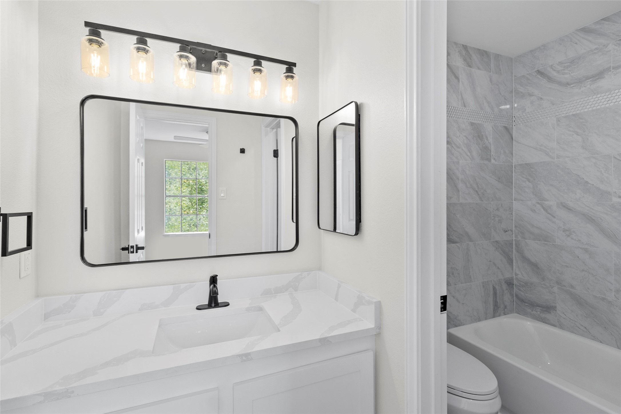 2030 Plantation Drive, Unit F3 Conroe, TX 77301 - Photo 17 of 22 a bathroom with a bathtub and a sink