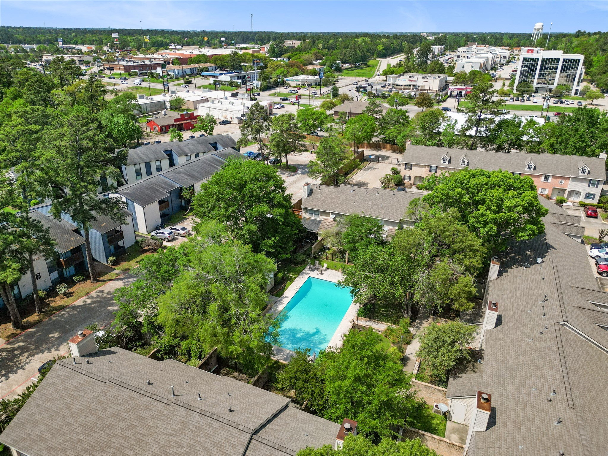 2030 Plantation Drive, Unit F3 Conroe, TX 77301 - Photo 22 of 22 an aerial view of residential houses with outdoor space and street view