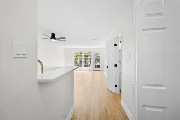 a view of gallery with wooden floor