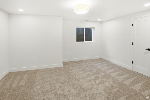 8760 Rustler Road Cottonwood Heights, UT 84093 - Photo 38 of 57 Neutral carpet flooring with white baseboards