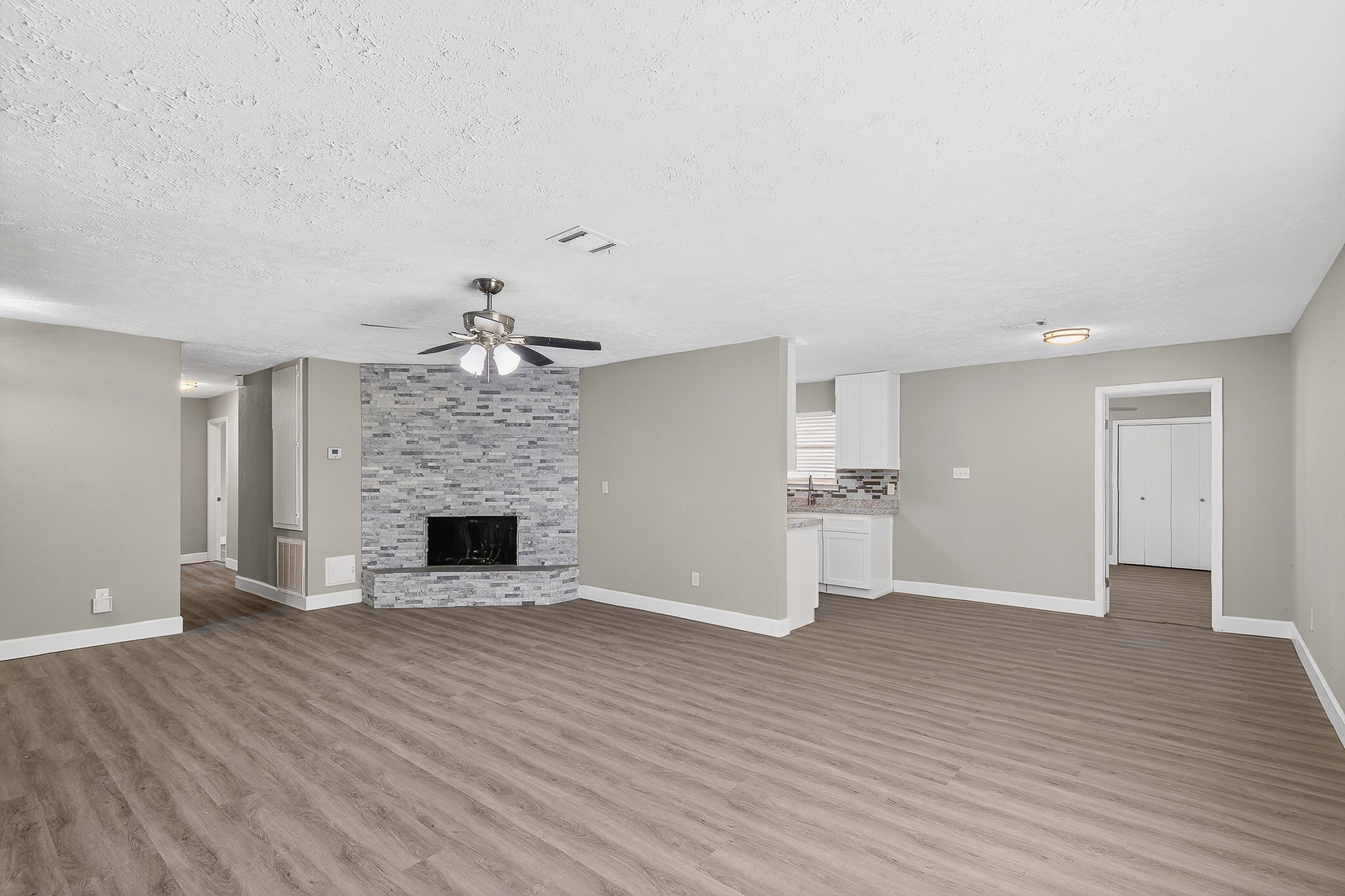 2510 Marble Falls Drive Spring, TX 77373 - Photo 7 of 26 wooden floor fireplace and windows in an empty room