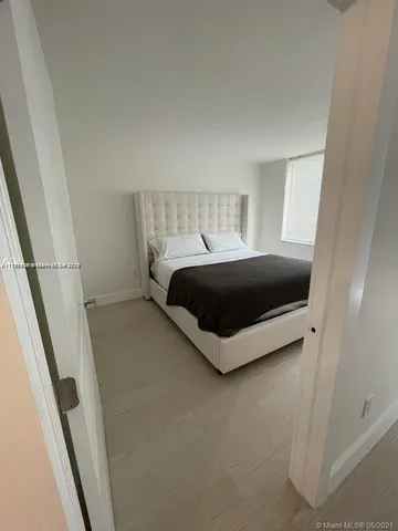 a room with a bed and a window