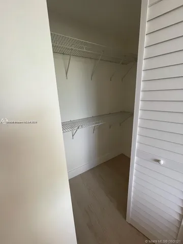 a view of an empty walk in closet