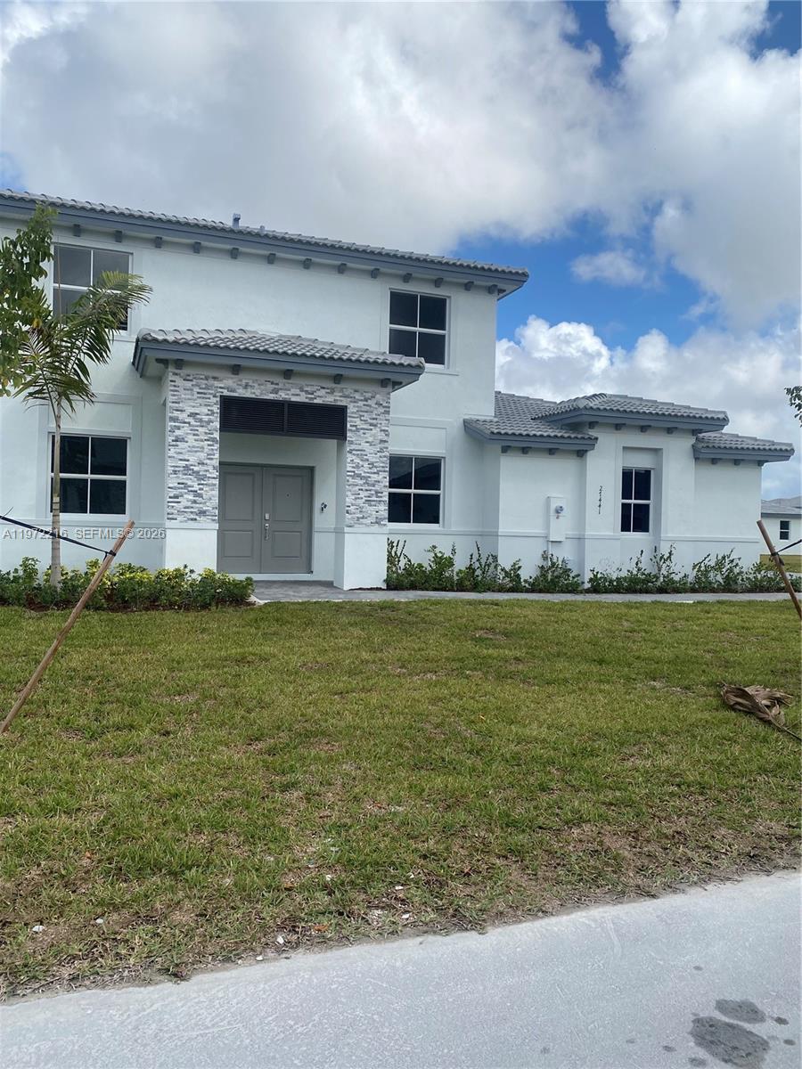 27441 Southwest 160th Avenue Homestead, FL 33031 - Photo 1 of 12 a front view of house with yard
