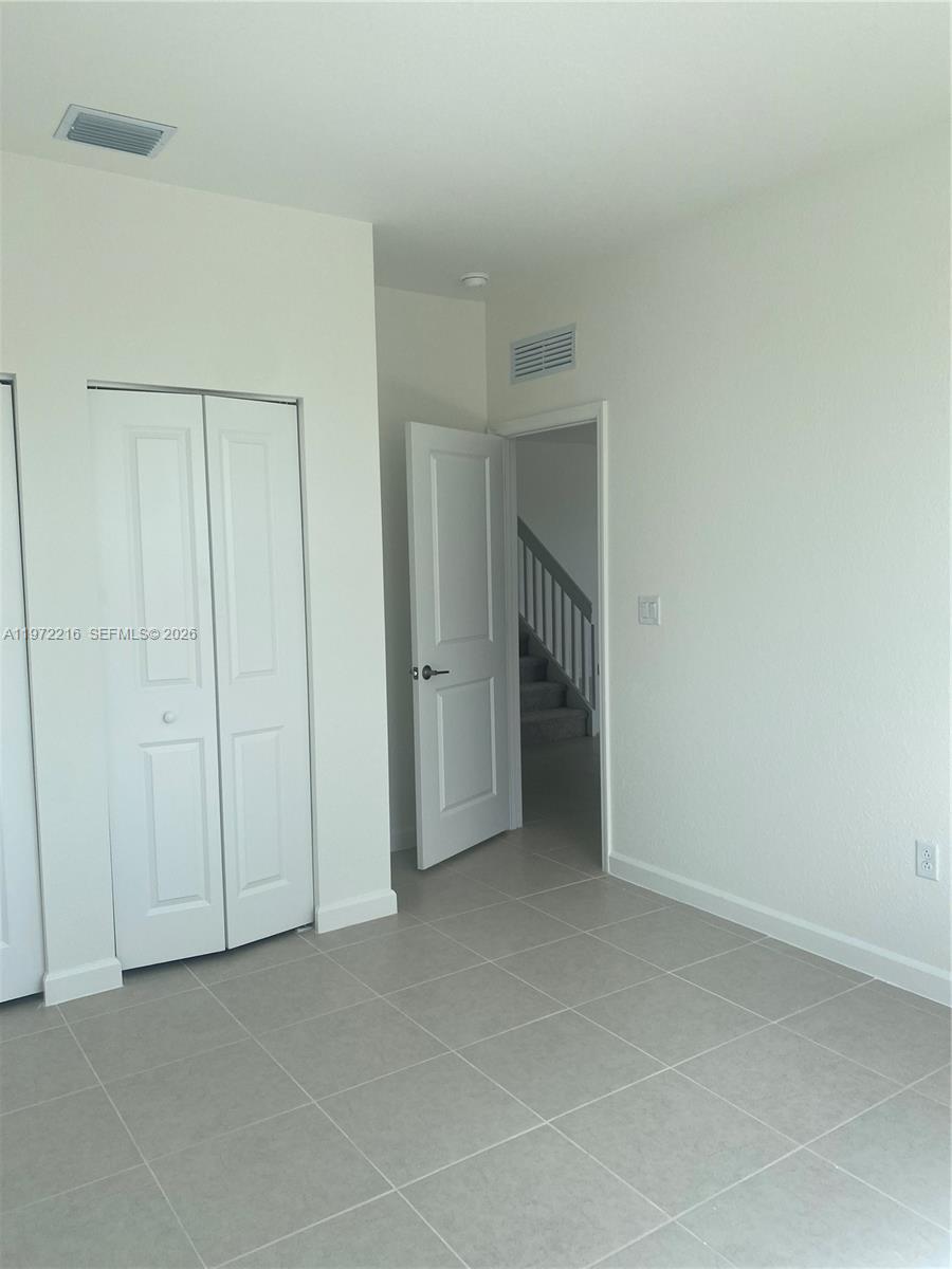 27441 Southwest 160th Avenue Homestead, FL 33031 - Photo 4 of 12 a view of an empty room and closet area
