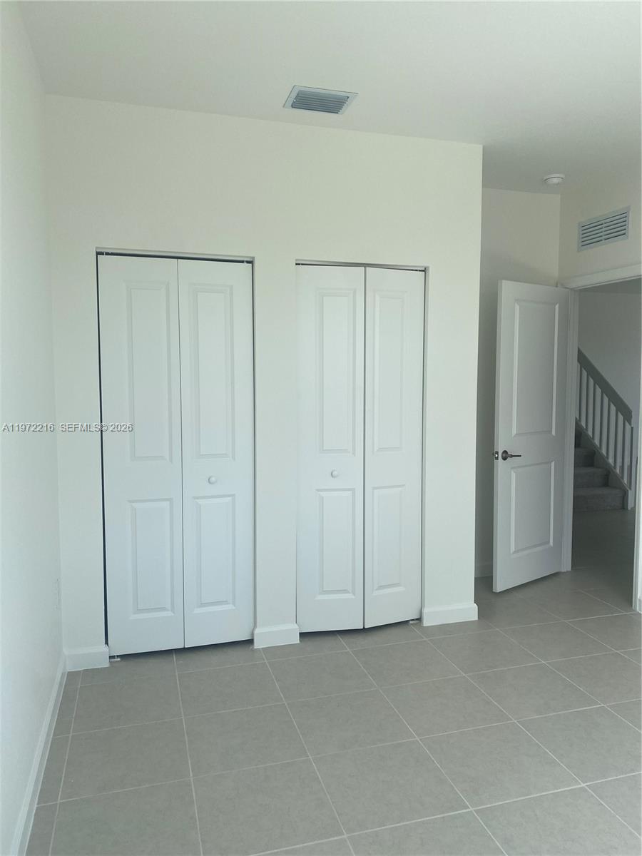 27441 Southwest 160th Avenue Homestead, FL 33031 - Photo 5 of 12 a view of an empty room