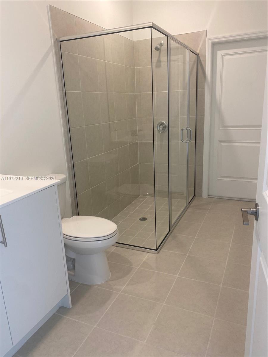 27441 Southwest 160th Avenue Homestead, FL 33031 - Photo 7 of 12 a bathroom with a toilet and a shower
