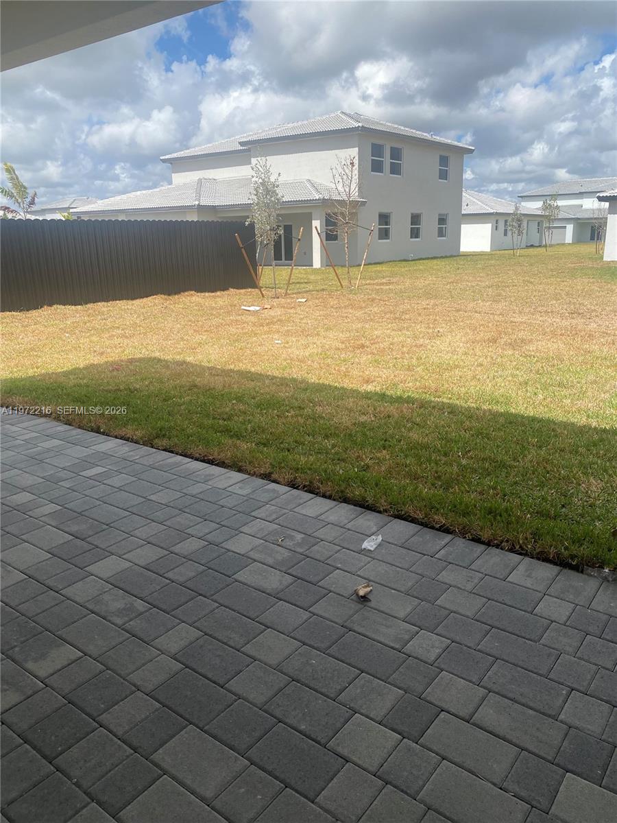 27441 Southwest 160th Avenue Homestead, FL 33031 - Photo 10 of 12 a view of a big room with wooden fence