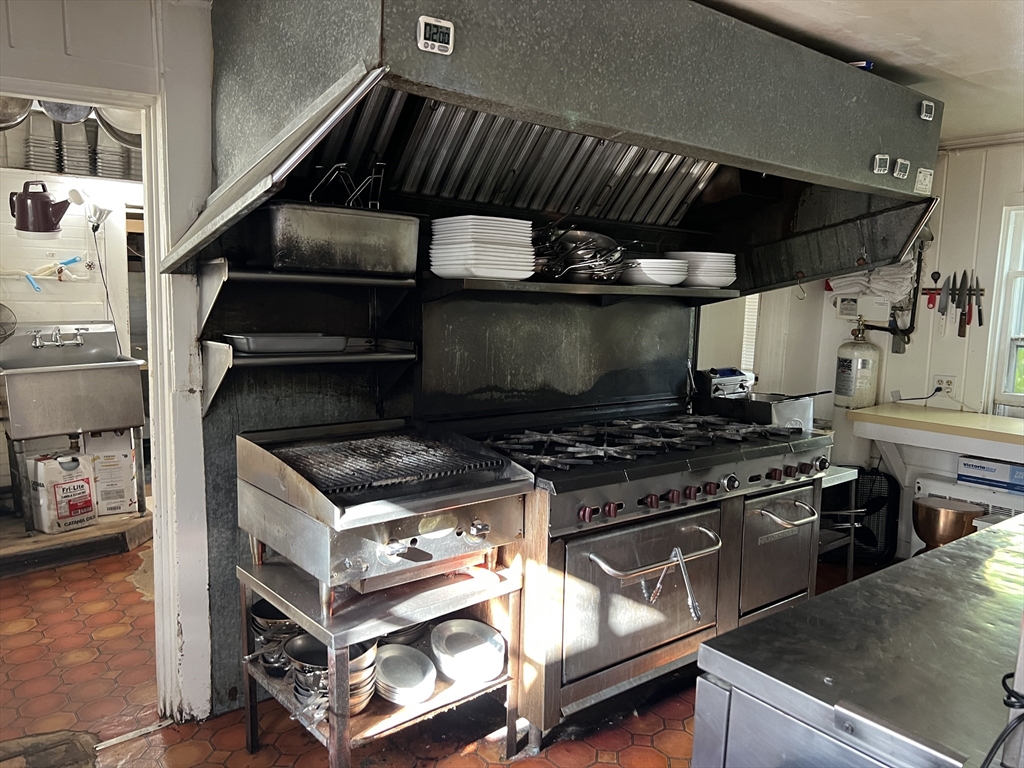 2019 Main Street Brewster, MA 02631 - Photo 14 of 17 a stove top oven sitting inside of a kitchen