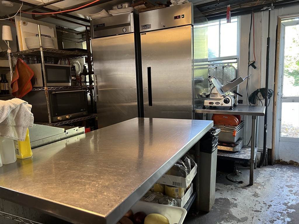 2019 Main Street Brewster, MA 02631 - Photo 15 of 17 a kitchen with a sink a counter top space and stainless steel appliances