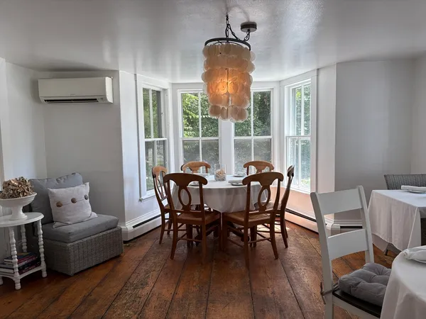 a view of a dining room with furniture window and outside view