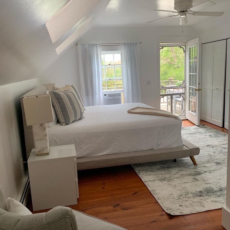 2019 Main Street Brewster, MA 02631 - Photo 7 of 17 a bedroom with a bed and window