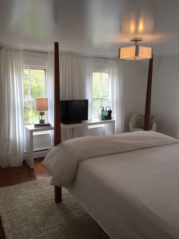2019 Main Street Brewster, MA 02631 - Photo 8 of 17 a bedroom with a bed and window