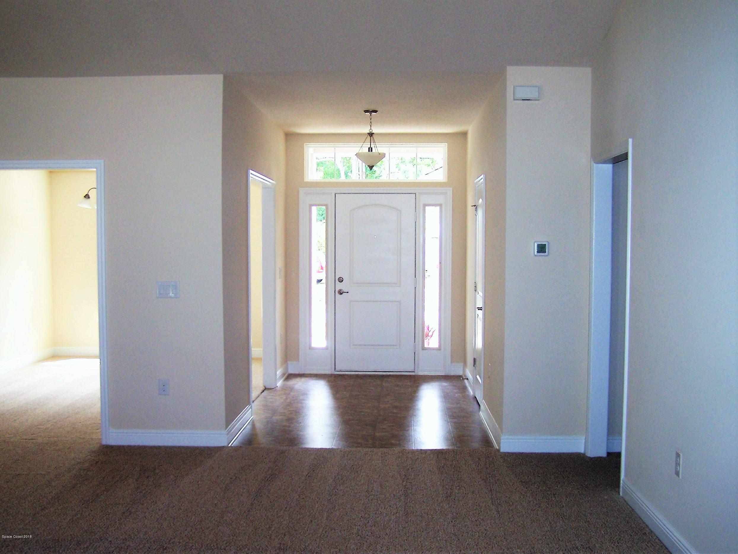 1539 Summit Road Palm Bay, FL 32909 - Photo 8 of 18 2117 Foyer and Dining Room