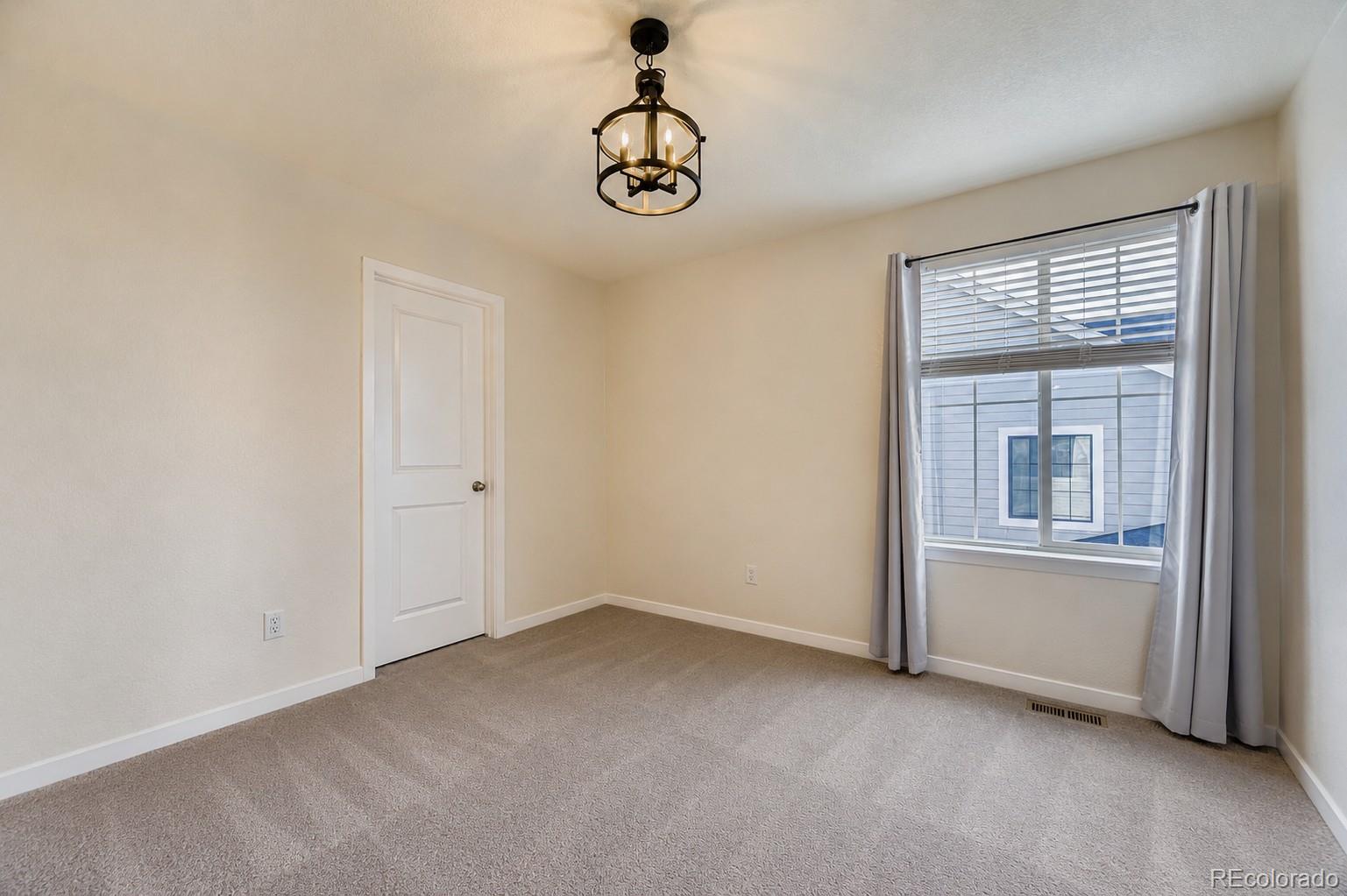 1173 Williams Loop Elizabeth, CO 80107 - Photo 19 of 30 a view of empty room with window