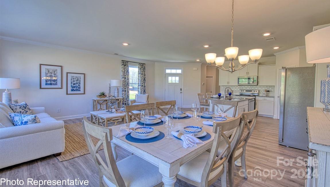 513 Wheatfield Road Fletcher, NC 28732 - Photo 20 of 47 a view of a dining room with furniture and wooden floor
