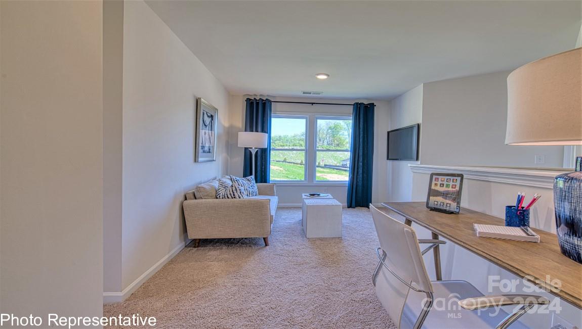 513 Wheatfield Road Fletcher, NC 28732 - Photo 27 of 47 a living room with furniture and a window