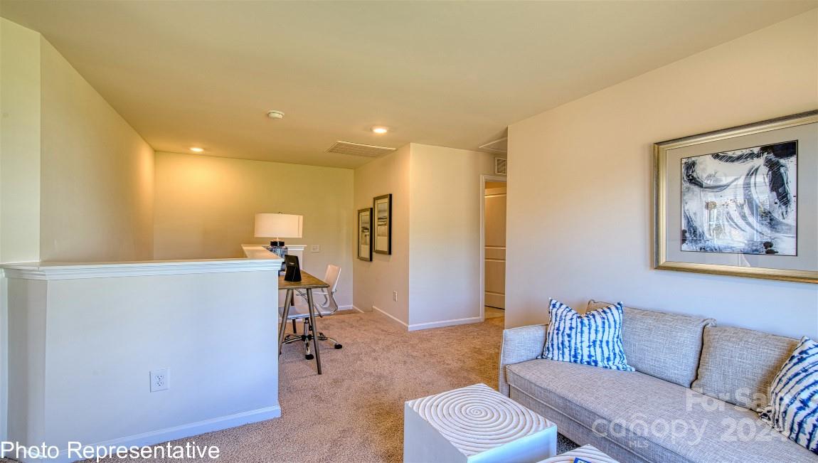 513 Wheatfield Road Fletcher, NC 28732 - Photo 29 of 47 a living room with furniture and a wooden floor