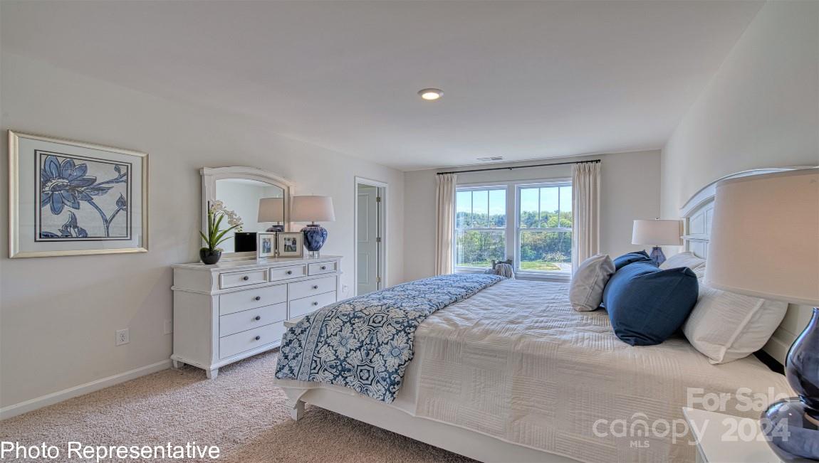513 Wheatfield Road Fletcher, NC 28732 - Photo 33 of 47 a bedroom with a large bed and a window