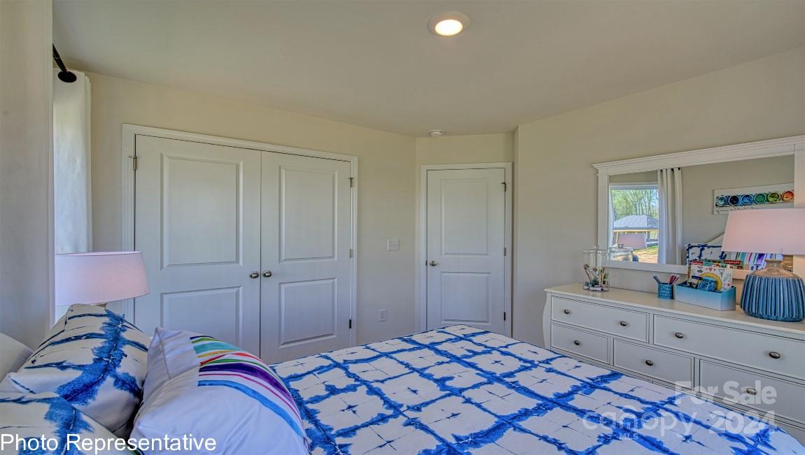 513 Wheatfield Road Fletcher, NC 28732 - Photo 42 of 47 a bedroom with a bed and a dresser in it