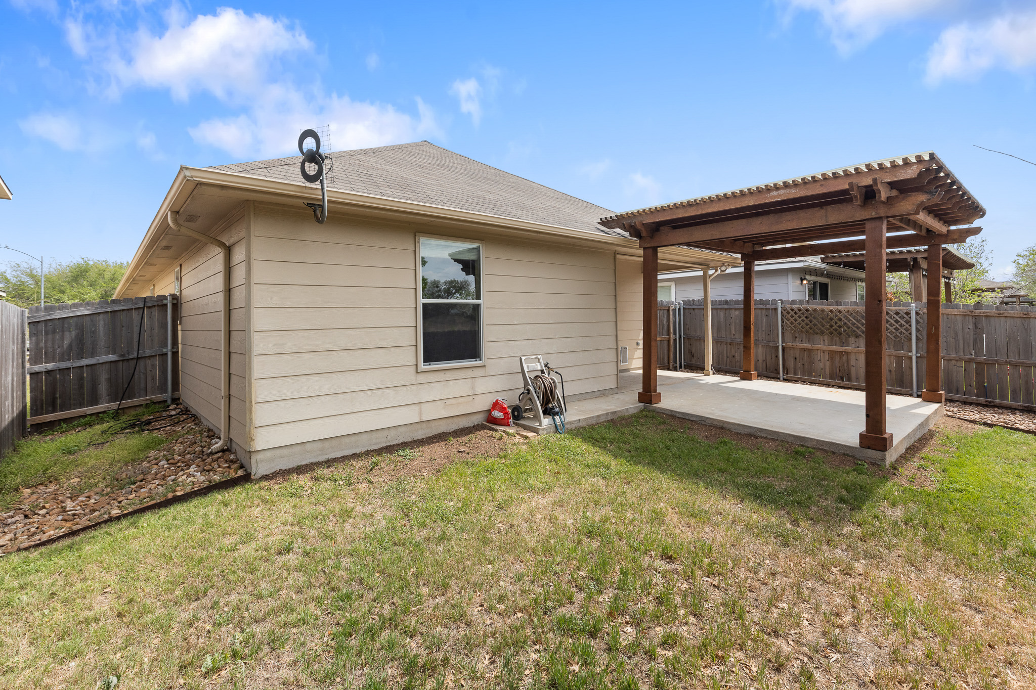 11400 Ashbrook Drive Manchaca, TX 78652 - Photo 30 of 32 a house view with a backyard space