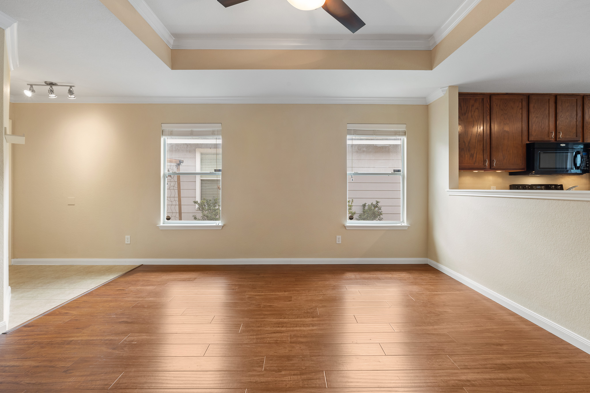 11400 Ashbrook Drive Manchaca, TX 78652 - Photo 4 of 32 an empty room with wooden floor and windows