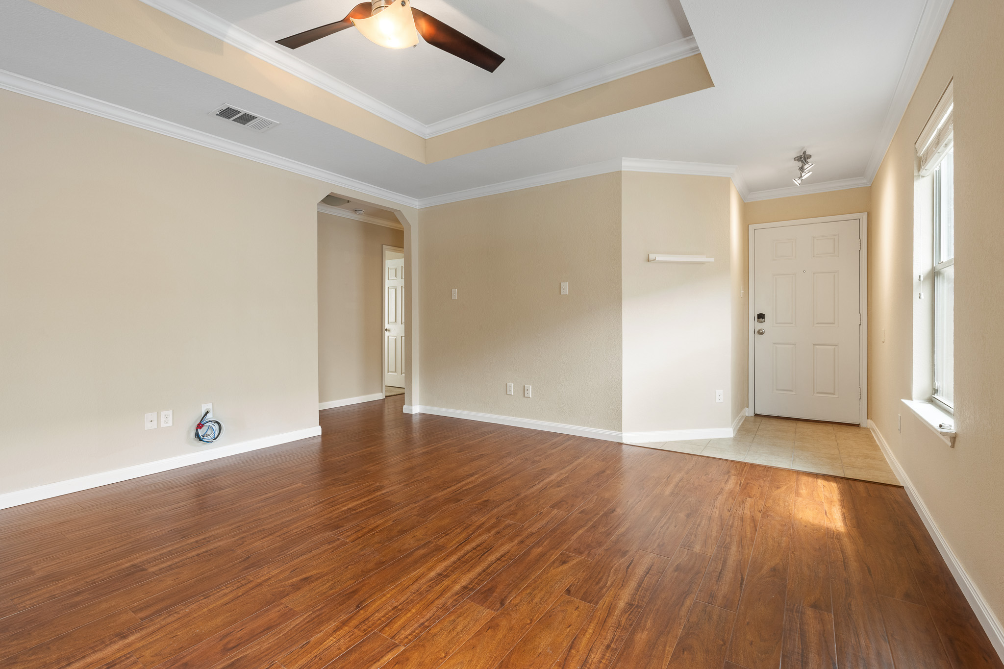 11400 Ashbrook Drive Manchaca, TX 78652 - Photo 5 of 32 an empty room with wooden floor and windows