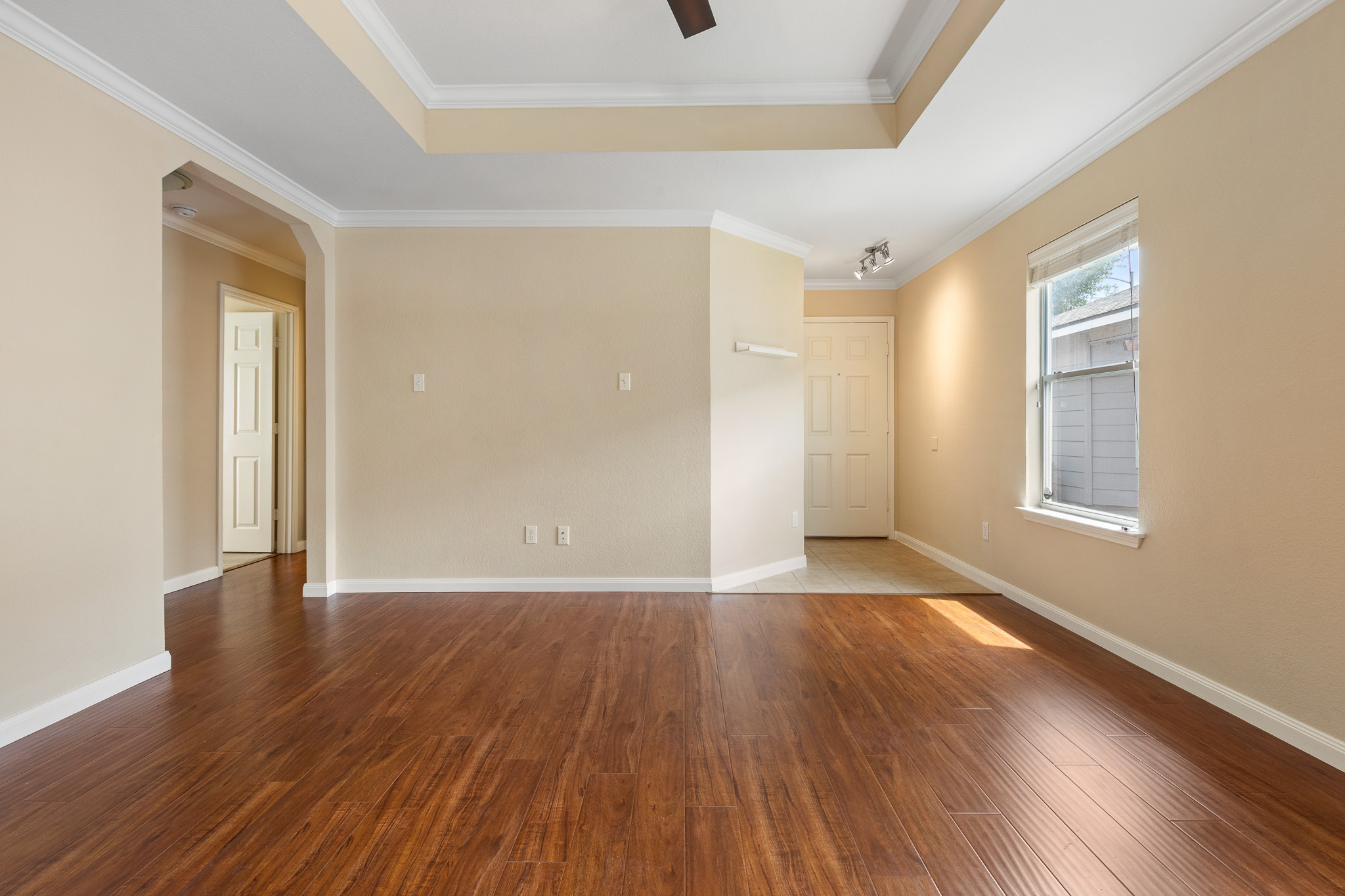 11400 Ashbrook Drive Manchaca, TX 78652 - Photo 7 of 32 a view of an empty room with wooden floor and a window