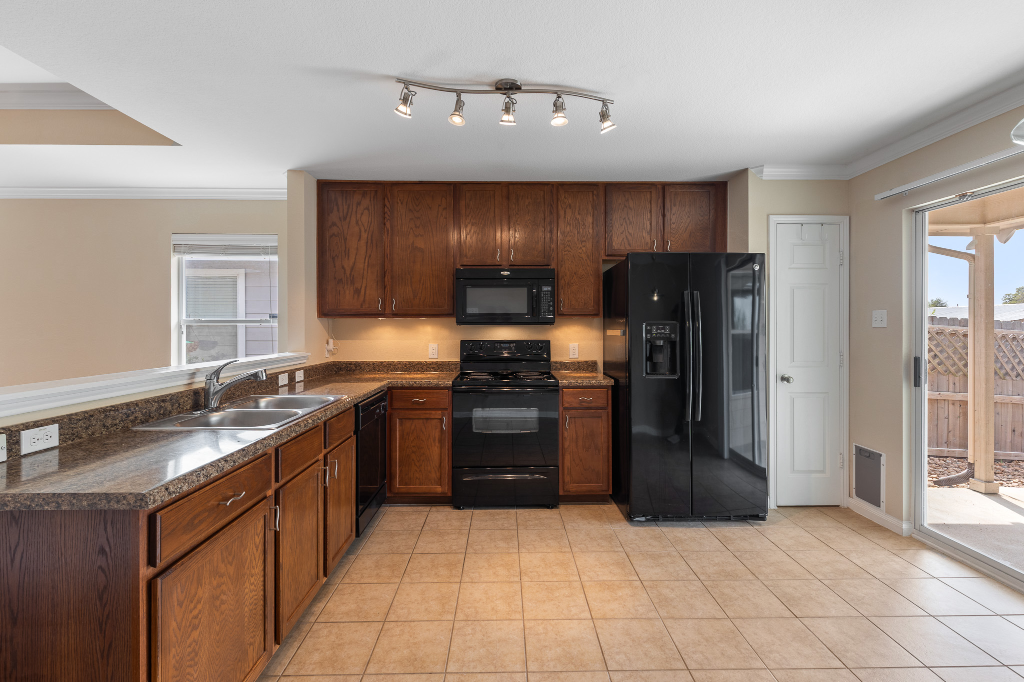 11400 Ashbrook Drive Manchaca, TX 78652 - Photo 10 of 32 a kitchen with a refrigerator sink and stove