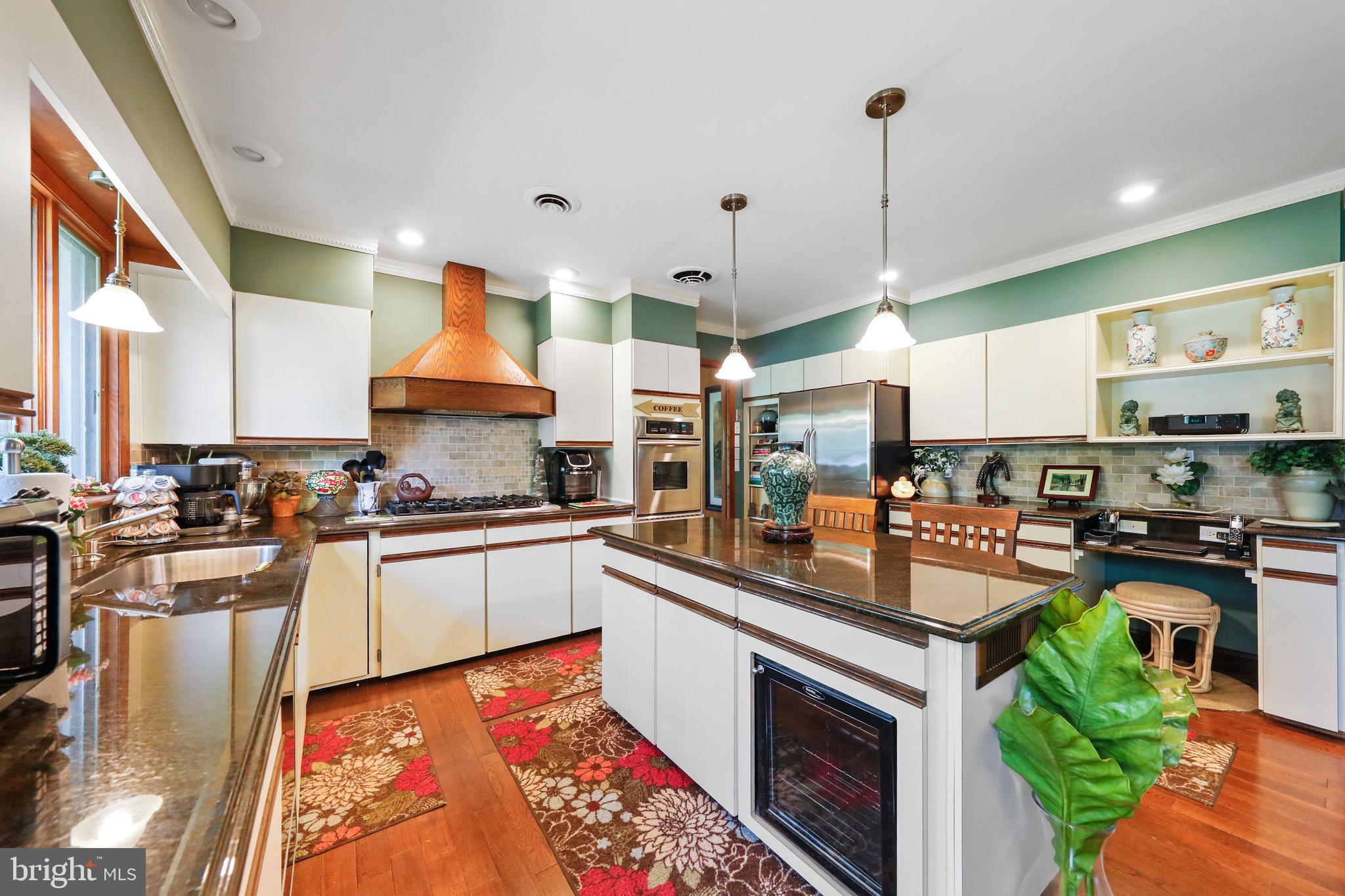 19 Diane Drive Ewing, NJ 08628 - Photo 16 of 38 a kitchen with stainless steel appliances granite countertop a stove a sink and a refrigerator