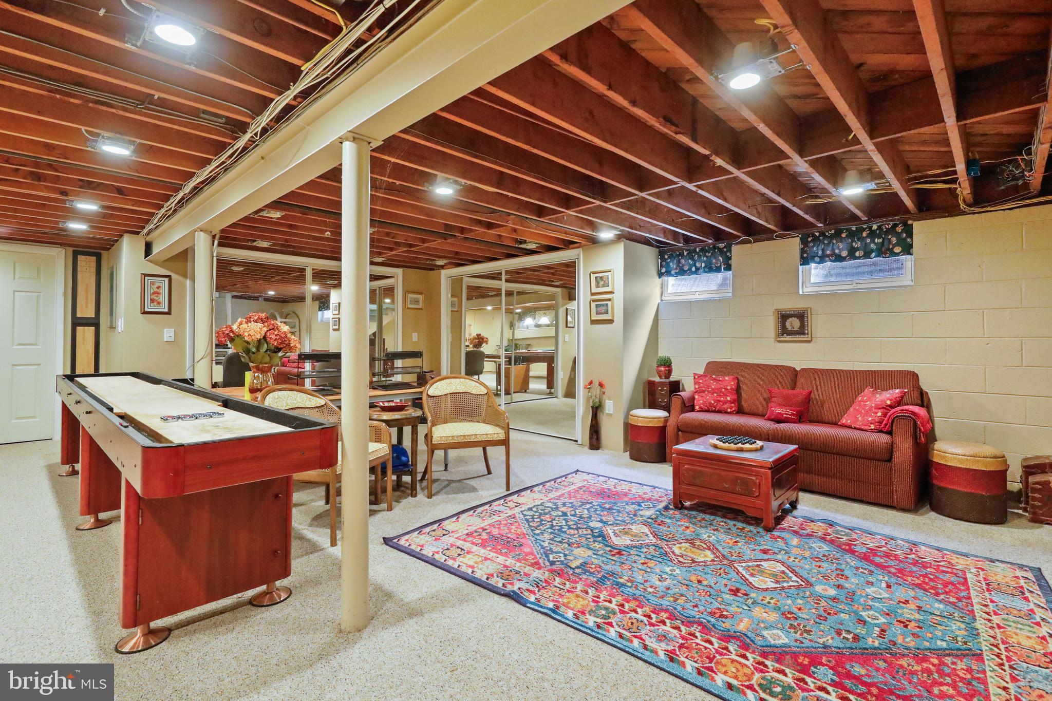 19 Diane Drive Ewing, NJ 08628 - Photo 37 of 38 a living room with patio furniture and a wooden floor