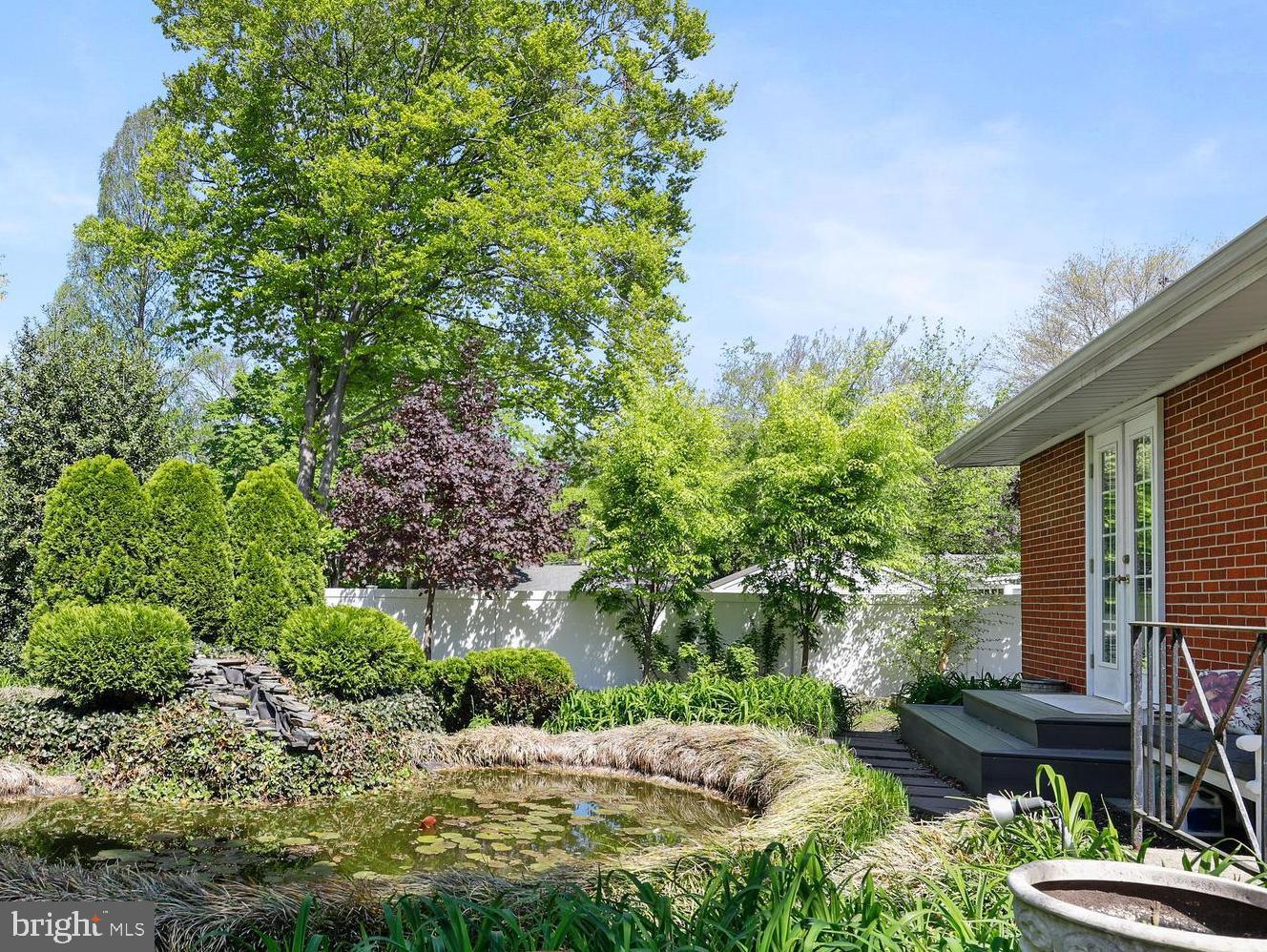 19 Diane Drive Ewing, NJ 08628 - Photo 4 of 38 a view of a backyard with plants and a garden