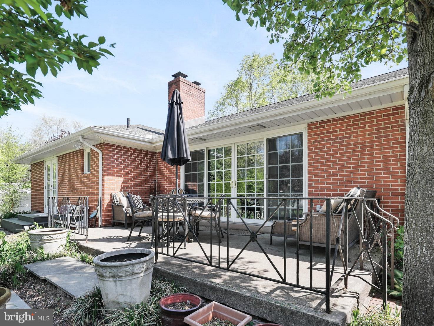 19 Diane Drive Ewing, NJ 08628 - Photo 5 of 38 a view of a patio with couches table and chairs and potted plants