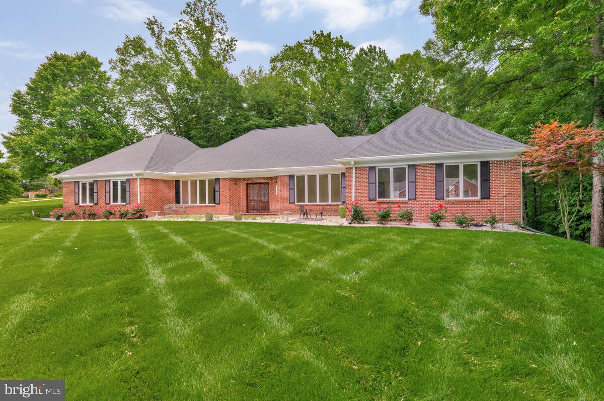 3170 Hickory Ridge Road Dunkirk, MD 20754 - Photo 1 of 74 a front view of a house with a yard and trees