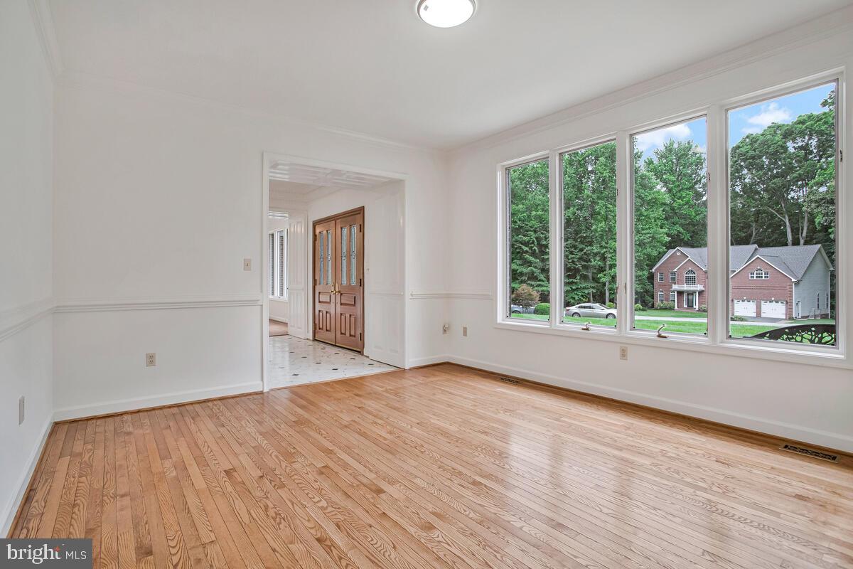 3170 Hickory Ridge Road Dunkirk, MD 20754 - Photo 12 of 74 a view of an empty room with wooden floor and a window