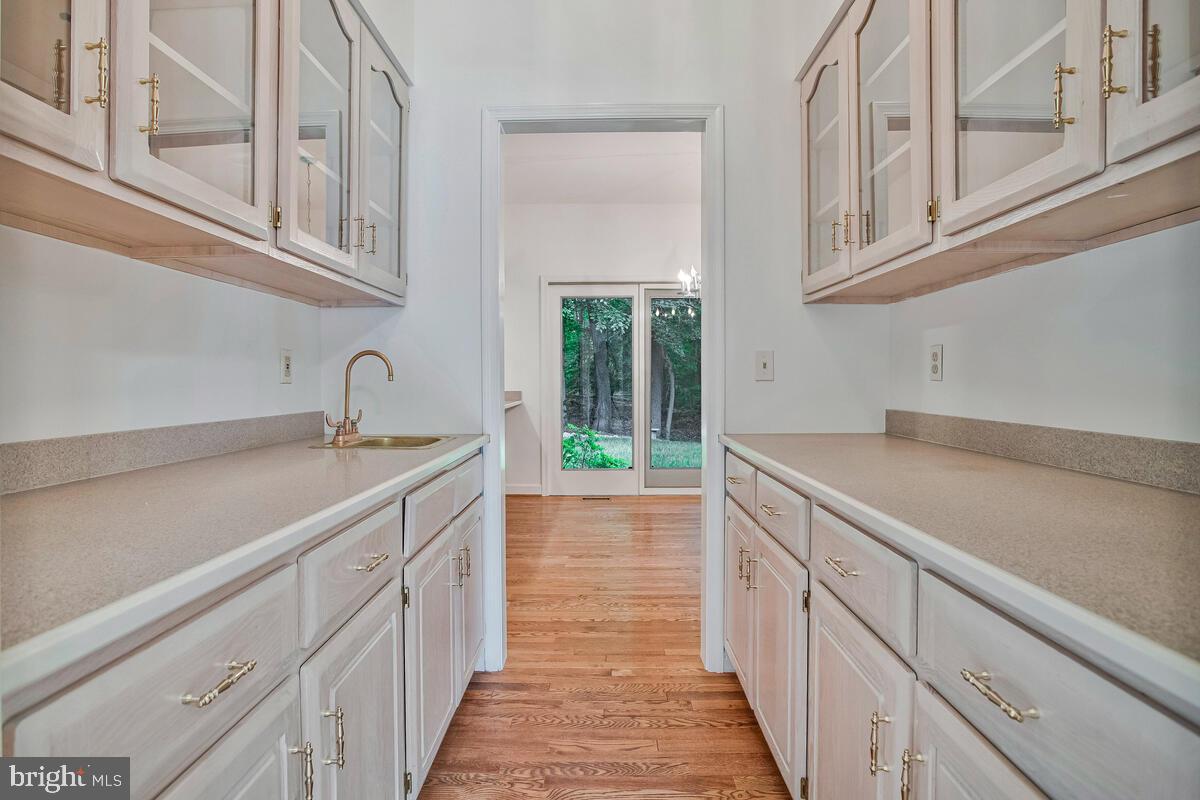3170 Hickory Ridge Road Dunkirk, MD 20754 - Photo 13 of 74 a kitchen with stainless steel appliances granite countertop a sink and dishwasher with white cabinets