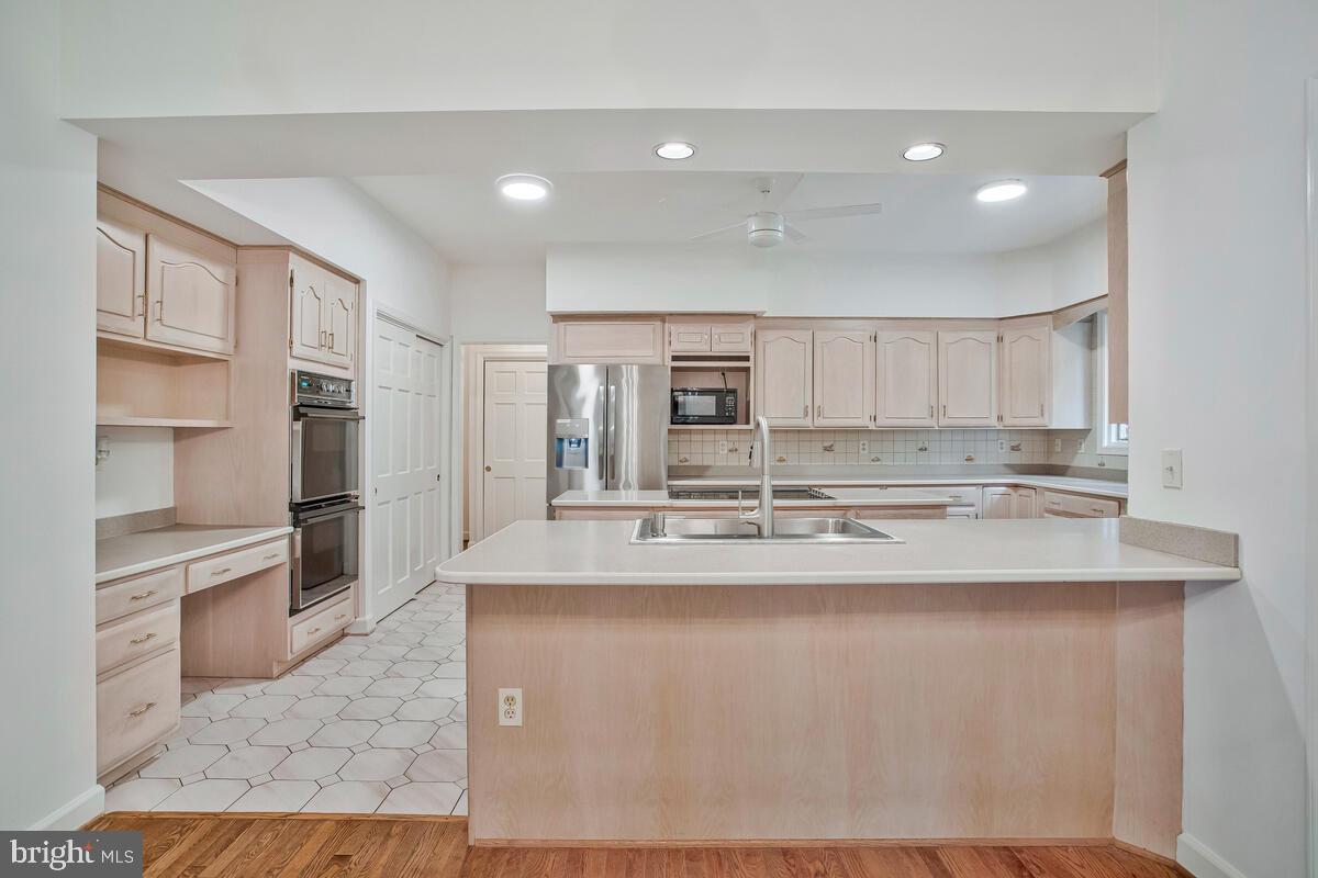 3170 Hickory Ridge Road Dunkirk, MD 20754 - Photo 14 of 74 a view of a kitchen with kitchen island a sink appliances and a counter top space