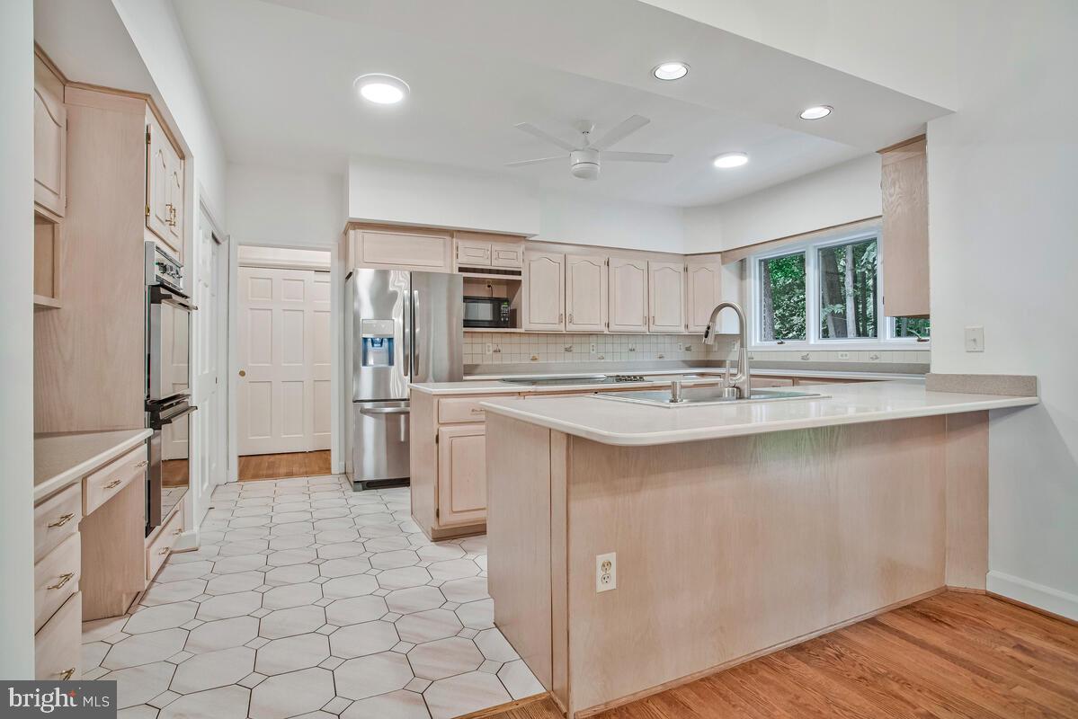 3170 Hickory Ridge Road Dunkirk, MD 20754 - Photo 15 of 74 a kitchen with stainless steel appliances granite countertop a refrigerator and a sink