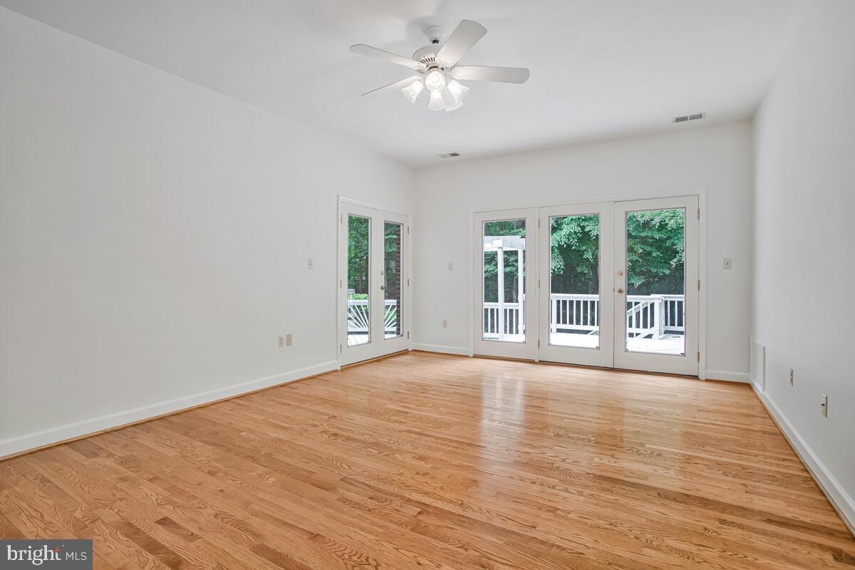 3170 Hickory Ridge Road Dunkirk, MD 20754 - Photo 29 of 74 a view of an empty room with a window and wooden floor