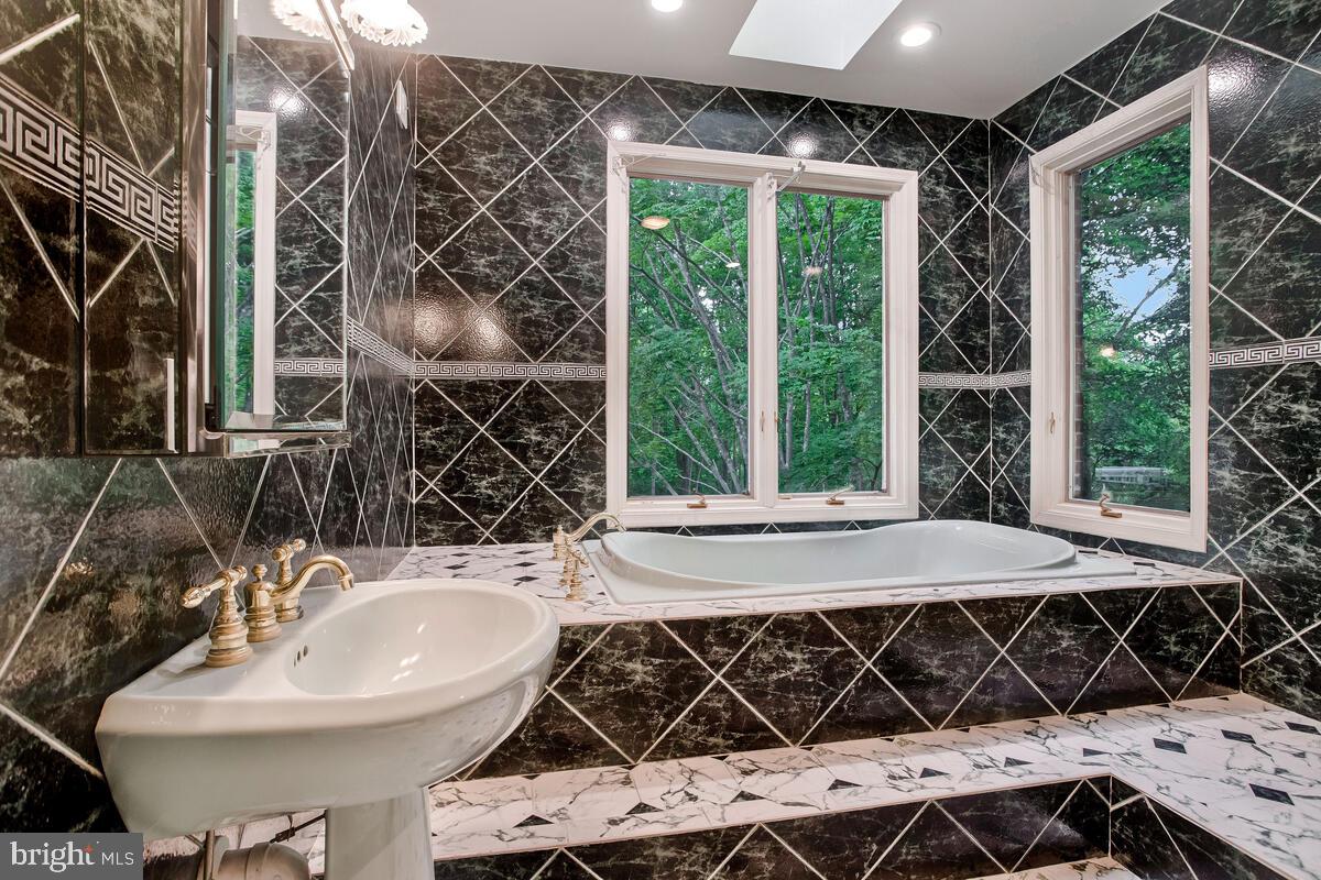 3170 Hickory Ridge Road Dunkirk, MD 20754 - Photo 33 of 74 a bathroom with a sink and a mirror