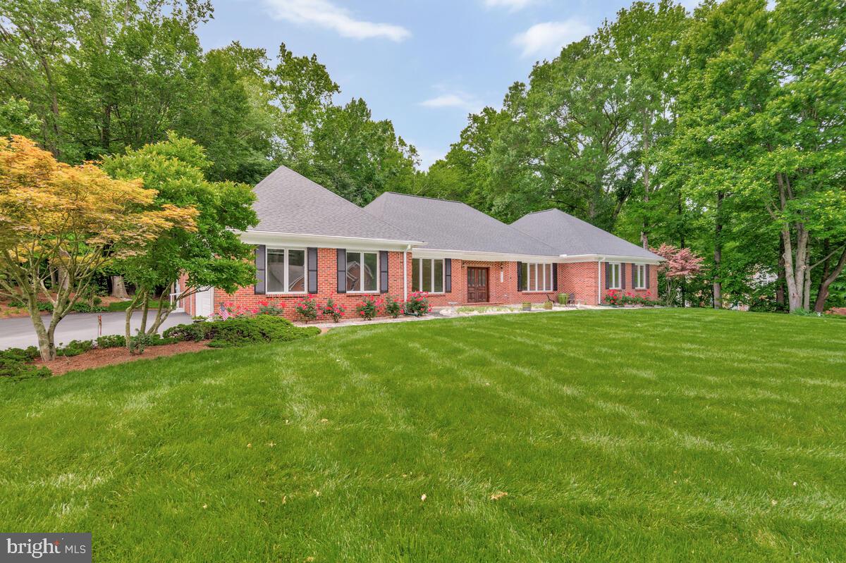 3170 Hickory Ridge Road Dunkirk, MD 20754 - Photo 4 of 74 a front view of a house with a garden