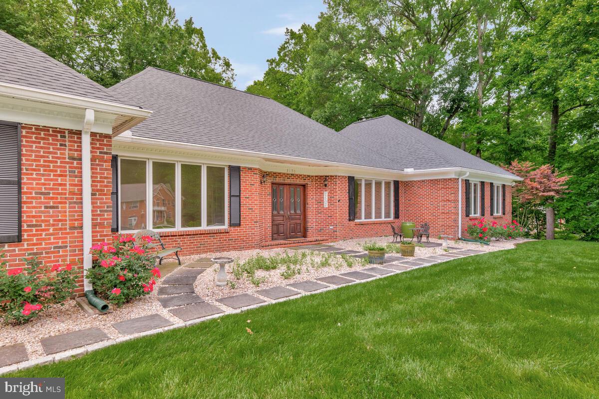 3170 Hickory Ridge Road Dunkirk, MD 20754 - Photo 5 of 74 a front view of a house with a garden and yard