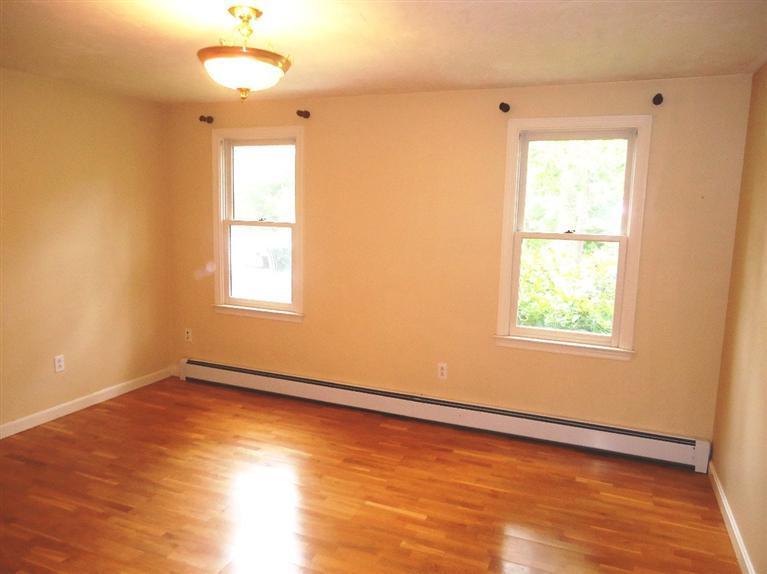 261 Simon Narrows Road Mashpee, MA 02649 - Photo 15 of 17 a view of an empty room with wooden floor and a window