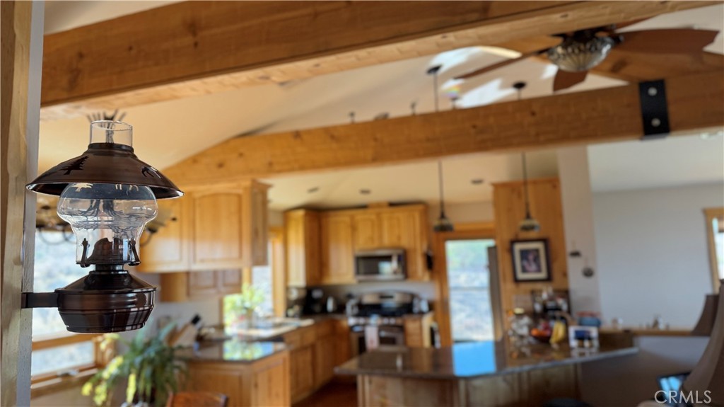275 Canyon Road Pinon Hills, CA 92372 - Photo 22 of 68 a living room with furniture and wooden floor